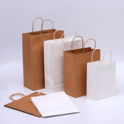 Ecologisch Bruine het document van gravurekraftpapier zakken met embleem gedrukte 28* 22cm